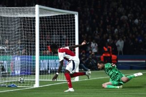 Bukayo Saka pulls a goal back for Arsenal in the second half / AFP