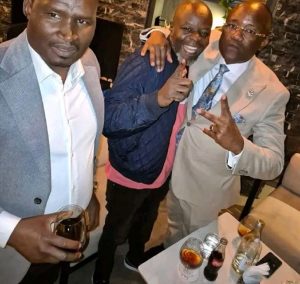 Philip Aroko in a party alongside Jared Otieno.