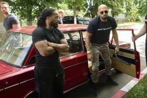 Andrew Tate and his brother Tristan, top left, arrives at a police station in a Lada vehicle in Voluntari, Romania, Wednesday, May 21, 2025. (AP Photo/Vadim Ghirda)