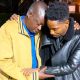 A screenshot showing Meshack Opiyo, the father of 31-year-old teacher Albert Ojwang being comforted by comedian Eric Omondi.