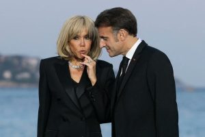 French President Emmanuel Macron listens to his wife Brigitte Macron before a dinner ahead of the third United Nations Ocean Conference (UNOC3), in the French Riviera city of Nice, on June 8, 2025. (Photo by AFP)