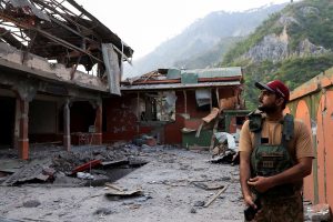 A Pakistan Army soldier stands at the premises of the Bilal Mosque, after it was hit by an Indian strike in Muzaffarabad, the capital of Pakistan-administered Kashmir, May 7, 2025. REUTERS