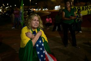 Supporters of Brazil's convicted ex-president Jair Bolsonaro argue he is the victim of political persecution / AFP