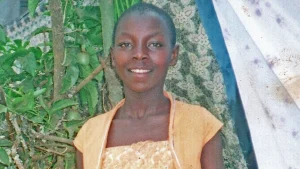 Monic grew up with 10 siblings in rural Uganda
