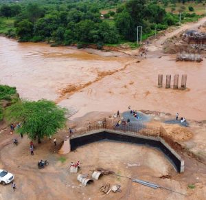The stalled bridge on River Enziu in Kitui County pictured on November 22, 2023. In December 2021, a 51-seater bus belonging to St. Joseph Seminary Mwingi ferrying Good Shephard Catholic Parish choir members that were heading to Nuu Catholic Church for a wedding plunged into the river killing 32 people.