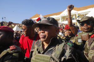 Colonel Michael Randrianirina arrives with members of the military to join protesters gathered outside the town hall on Independence Avenue during a nationwide youth-led demonstration