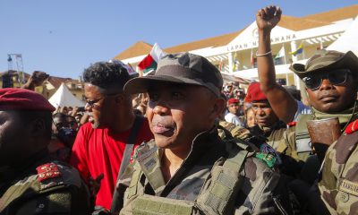 Colonel Michael Randrianirina arrives with members of the military to join protesters gathered outside the town hall on Independence Avenue during a nationwide youth-led demonstration