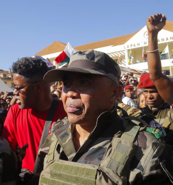 Colonel Michael Randrianirina arrives with members of the military to join protesters gathered outside the town hall on Independence Avenue during a nationwide youth-led demonstration