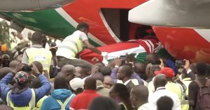 Body of Raila lowered from Kenya Airways’ RAO 001 plane at JKIA.