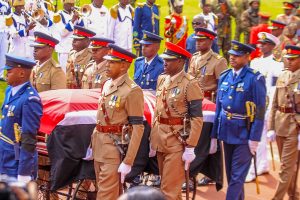 Maurice Ogeta (far right in blue) seen escorting the coffin bearing the remains of the late Prime Minister Raila Odinga. during State Funeral at Nyayo Stadium.