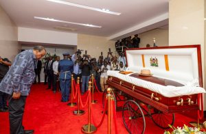 Former President Uhuru Kenyatta pays last respect to Raila Odinga lying in state in parliament.