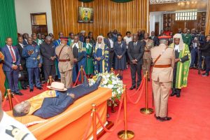 President Ruto pays last respect to Raila Odinga lying in state in parliament building.