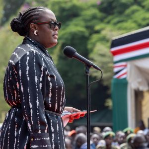 Winnie Odinga stands as she delivers last speech during father’s funeral in Bondo.