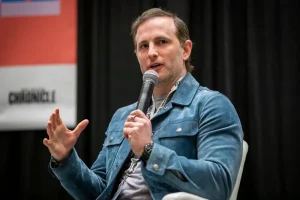 AirBnB co-founder Joe Gebbia speaks at the South By Southwest (SXSW) festival in Austin, on March 13, 2022. Gebbia was part of billionaire Elon Musk's DOGE team before leading President Donald Trump's recently-created National Design Studio, where he's directed to beautify government websites.Matthew Busch/Bloomberg via Getty Images