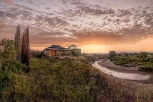 A rendering of the Ritz-Carlton camp shows its proximity to the Sand River. Credit...Marriott