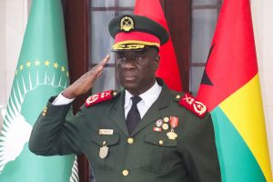 Major-General Horta Inta-a, the new transitional president, salutes during the swearing-in ceremony of Major-General Tomas Djassi as the new chief of staff of the Armed Forces in Bissau