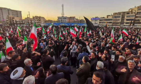 In Tehran's Enghlab square, thousands of mourners, dressed mostly in black, chanted 'death to America' while waving Iran's flag AFP