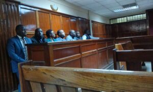 Seven suspects, led by Michael Musyoki Ngumbi, appear at the Milimani Law Courts dock in Nairobi over a Sh60.8 million fake ambulance tender scam, following their arrest at Harambee House, which hosts President William Ruto’s office.