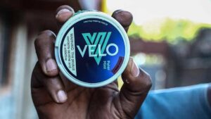 A young Nairobian Velo user shows off his pouch on social media